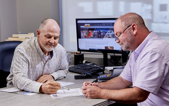 Rush employee talking to customer about financing