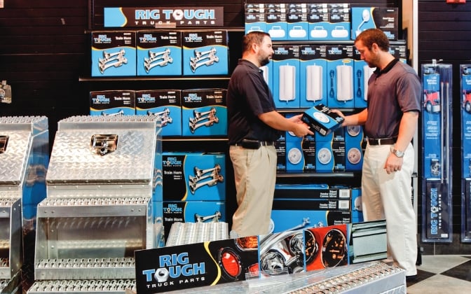 Employee helping customer purchase Rig Tough products