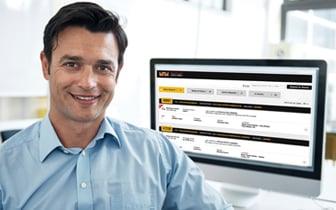 Man sitting in front of computer showing Service Connect