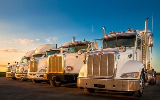 Lineup of trucks in parking lot