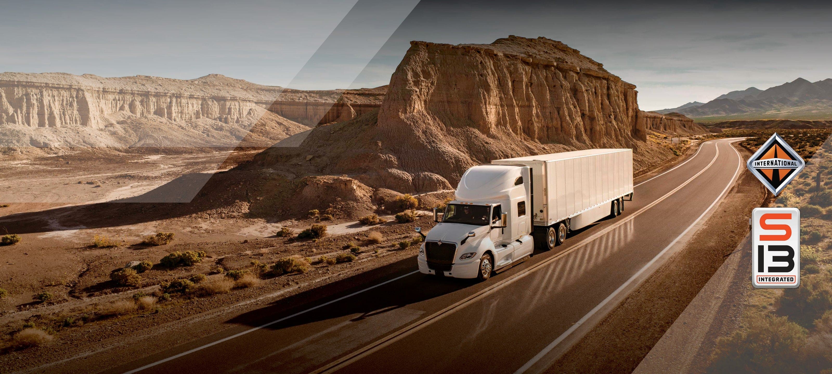 White International LT Series truck driving down mountain highway
