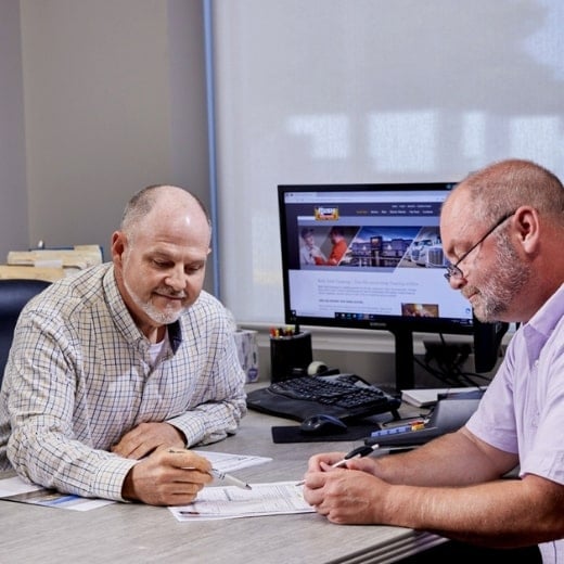 Rush employee talking to customer about financing