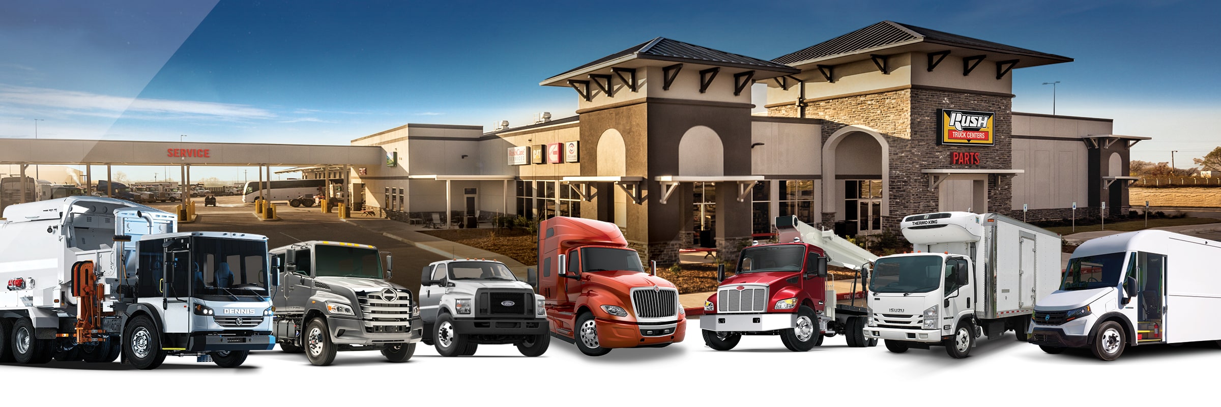 Line up of commercial vehicles from Peterbilt, International, Hino, Isuzu, Ford, Dennis Eagle and Blue Arc